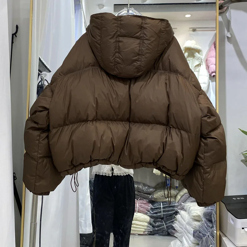 อารมณ์สั้นผู้หญิงCoat2025 ฤดูหนาวใหม่หนาลงเสื้อแจ็คเก็ตผู้หญิงHoodedหลวมเป็ดสีขาวลงผู้หญิงลงแจ็คเก็ตH555