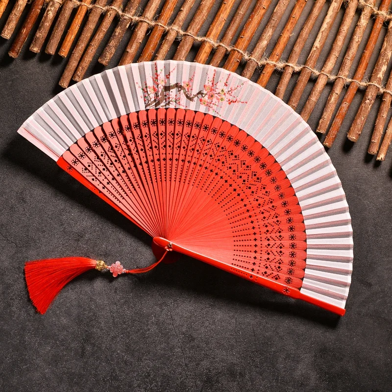 

Chinese style hand-painted plum blossom hollow folding fan Hanfu qipao runway with folding Japanese women's dance