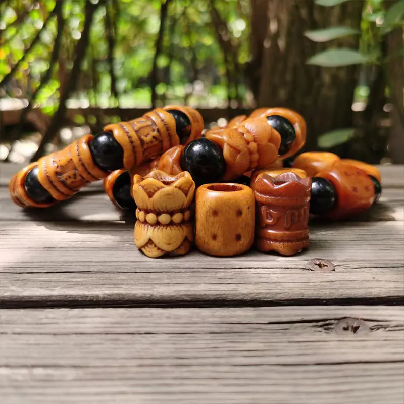 Tibetan- camel yak bone accessories featuring an aged carved design with a national-style lotus and six-side