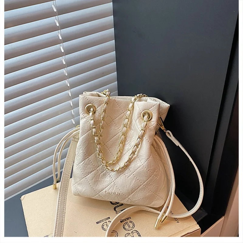 Women Quilted Drawstring Bucket Bag Chain Decor Crossbody Purse Glossy Solid Color Mini Shoulder Bag for Dating Party