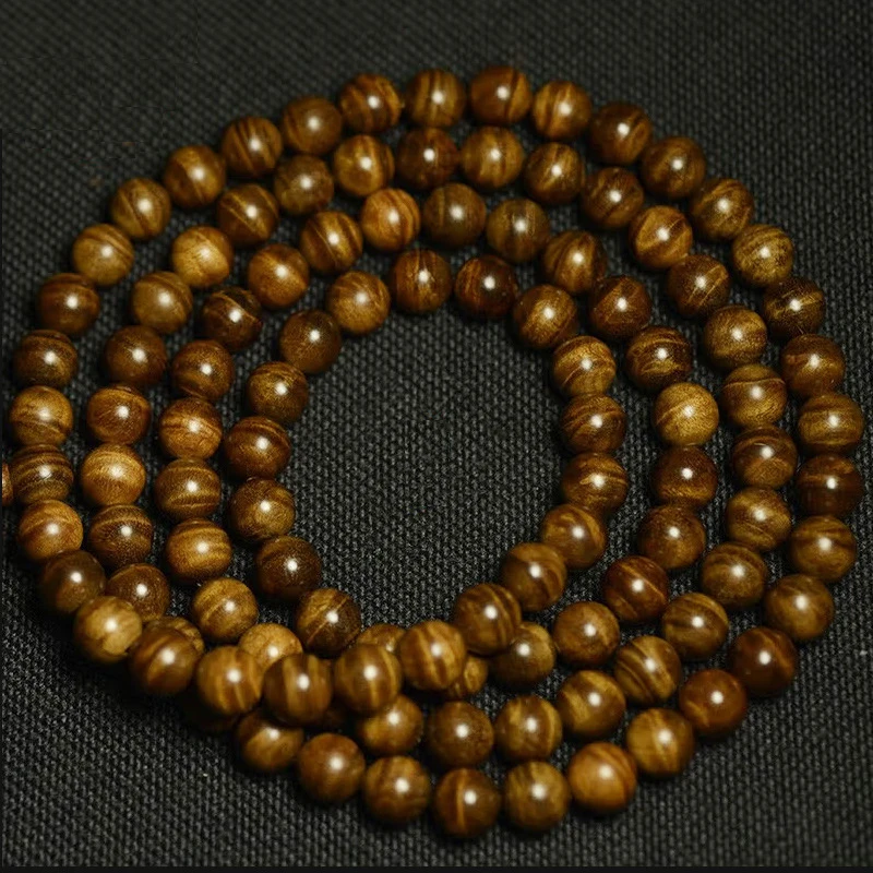Sichuan small-leaf golden nanmu wood bracelet with Buddhist beads couples 8mm full water ripple pattern dragon's heart