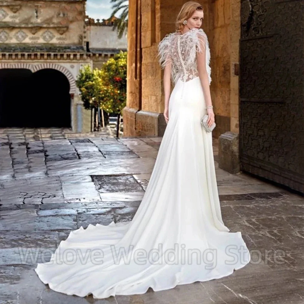 Elegant Deep V-Neck Mermaid Wedding Dress Sleeveless with Feathers Chic Illusion Tulle Applique Back Sweep Train Bride Gowns