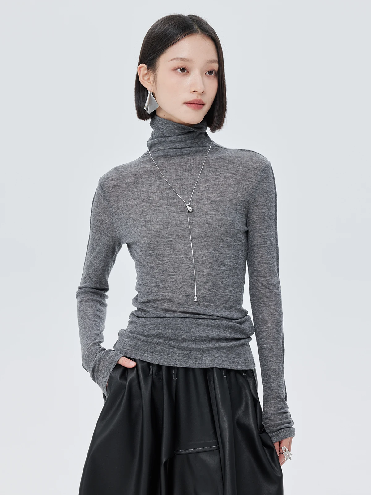 Nowa damska spódnica na jesień i zimę, czarna, asymetryczna, o średniej długości, elastyczna, z wysokim stanem, ze skóry ekologicznej (PU).