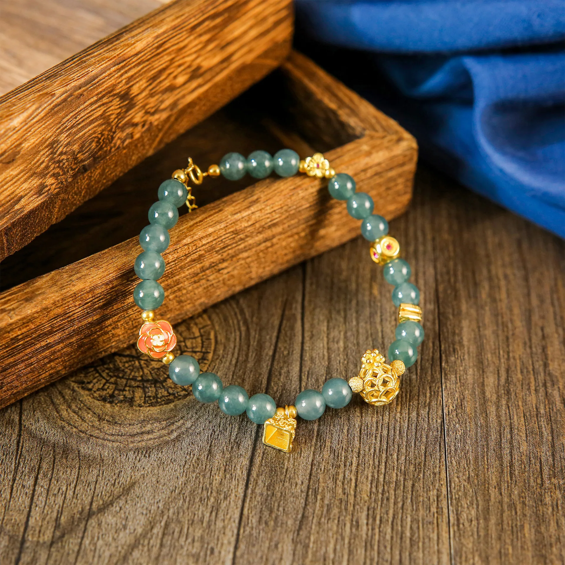 

Ice Blue Jadeite Beaded Bracelet with Gold Charms – Auspicious Oriental Style Jewelry