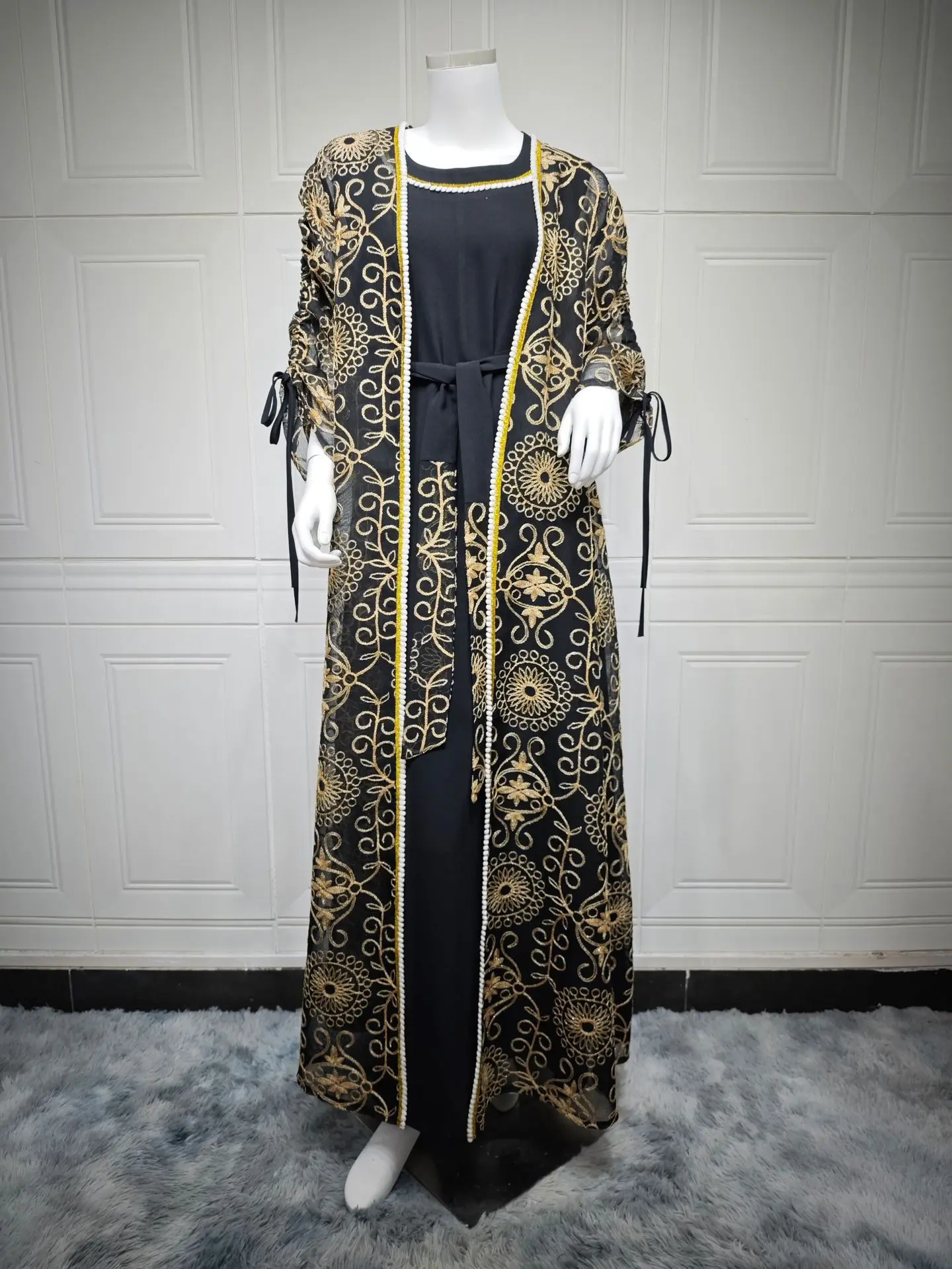 

Black Embroidered Muslim Abaya Exquisite Pattern Detailing Belt Accent Suited for Saudi Qatar Weddings Formal Ramadan Dressing
