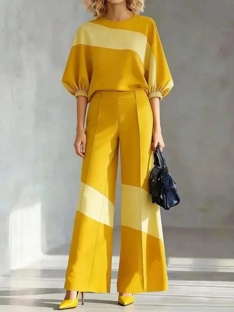 

Yeezzi 2026 Новинка: Модный женский повседневный комплект из двух предметов с контрастными цветами – топ с пышными рукавами и круглым вырезом, плиссированные брюки с широкими штанинами и карманами