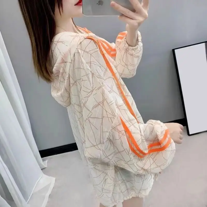 Fashion Hooded Spliced Lace Up Shirring Printed Zipper Shirt Women\'s Clothing 2023 Summer New Casual Tops All-match Blouse