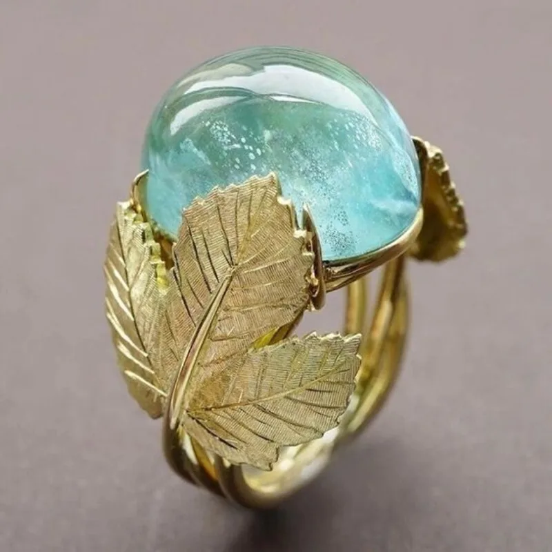 Vintage-Ring für Damen in Goldfarbe mit eingelegtem meerblauen Stein, Blatt- und geometrischer Schnitzerei, für den täglichen Gebrauch, Partyschmuck