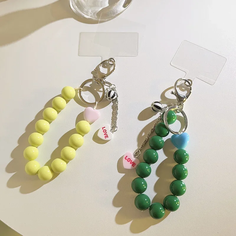 

Ремешок для телефона, короткий стильный ремешок на запястье, браслет ручной работы с сердечком из бисера, кулон, ремешок, широкий ремешок на запястье, ремешок против потери