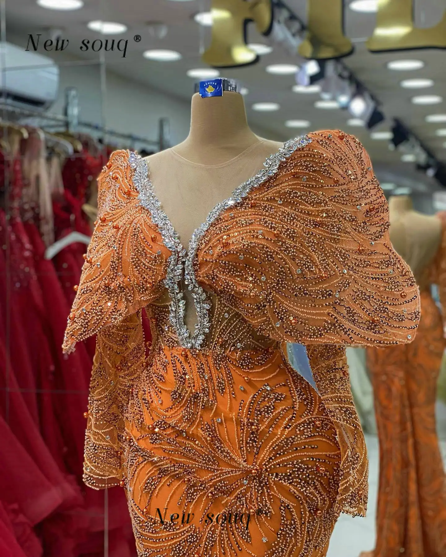 2023 Newest Orange Long Sleeves Mermaid Evening Dresses with Side Slit Sparkly Crystals Around Neck Dubai Formal Occasion Gowns