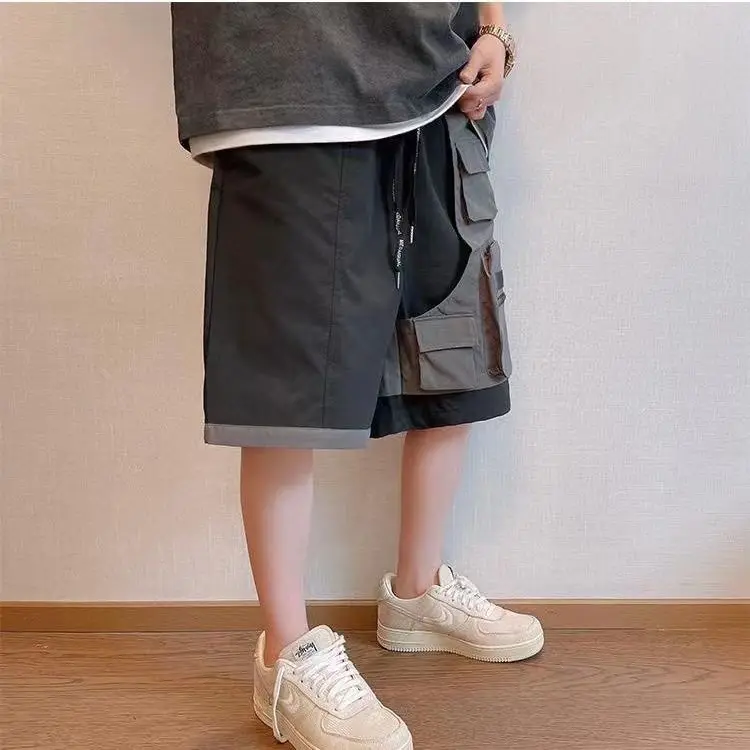 Pantalones cortos de trabajo de dos piezas con Bolsillo falso salvaje para hombre, pantalones sueltos de cinco pantalones, ropa de calle de