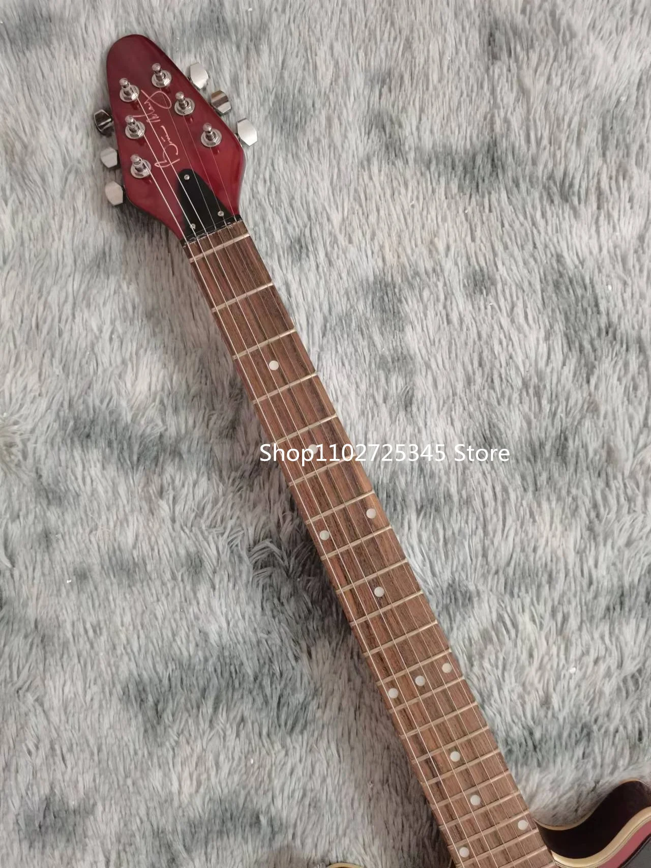 Electric Guitar with Mahogany Fingerboard, Gold Accessories, Vibrato Bridge, the Seller, The Freight