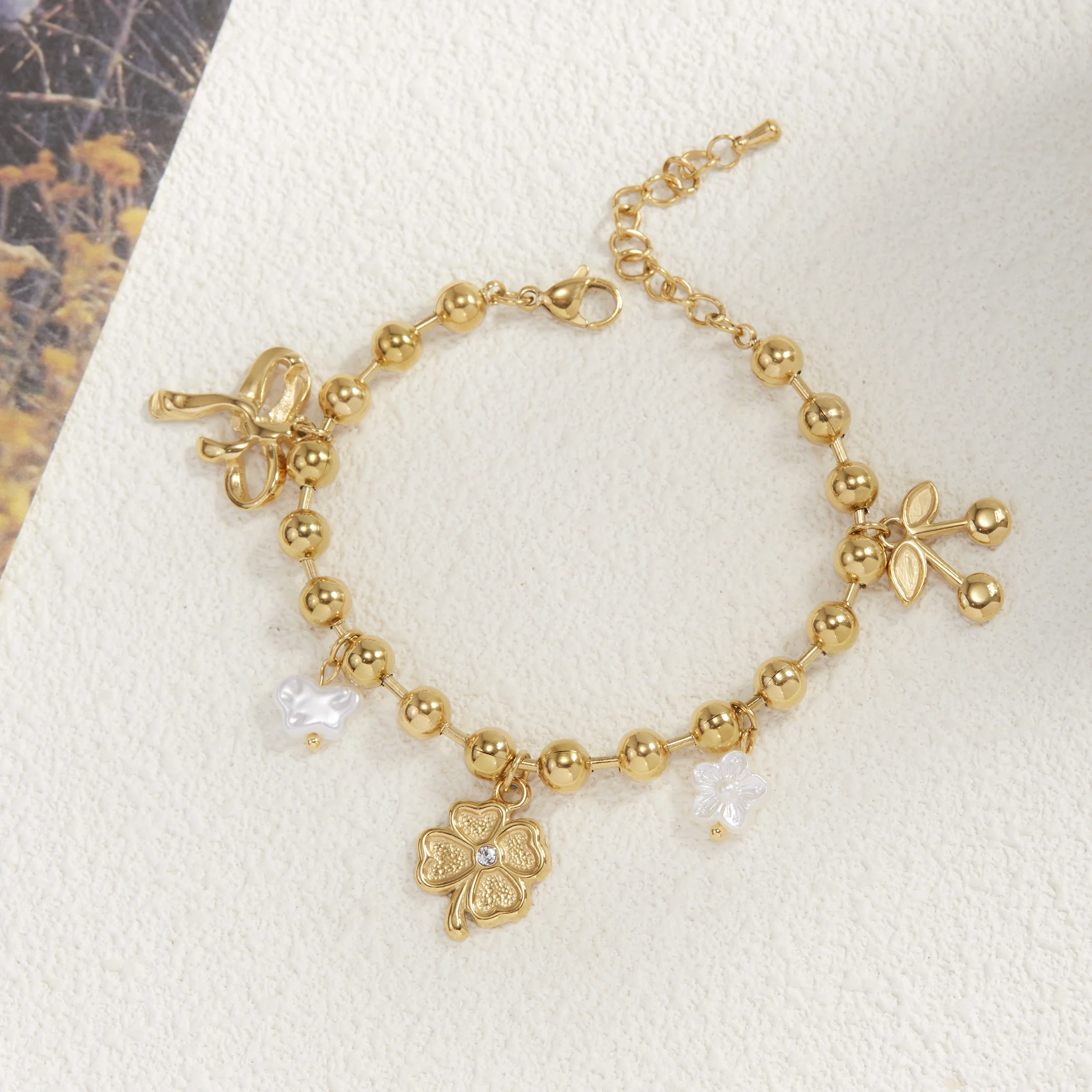 

Golden Tone Stainless Steel Clover and Cherry Charm Bracelet with Synthetic Zirconia for Women