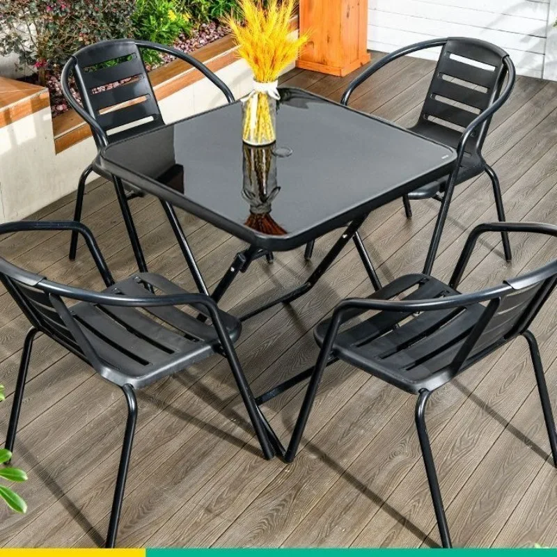Outdoor tables and chairs, wrought iron tables and chairs on the outdoor patio of the courtyard, dining tables and chairs