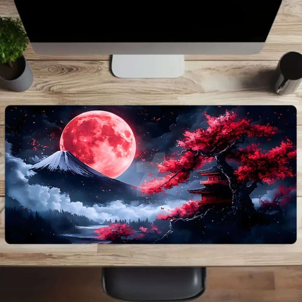 A Large Mouse Pad Featuring a Japanese Red Moon And Cherry Blossom Landscape, Designed for Gaming And Office Use