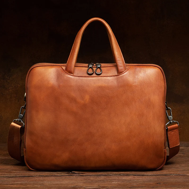 Luxury handcrafted vegetable-tanned leather briefcase for men, perfect for business and laptop use, with a vintage design and st