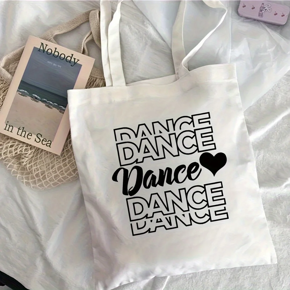 A 'DANCE' letters and heart-shaped decorations pattern print canvas tote bag, suitable for daily use, shopping, school, and trav