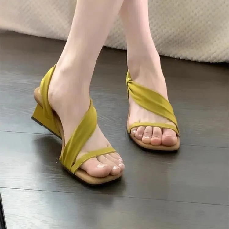 

In The Summer of 2025, The New French-style Women's Sandals with Wedges and Square Heads Wear Open-toed High-heeled Sandals.