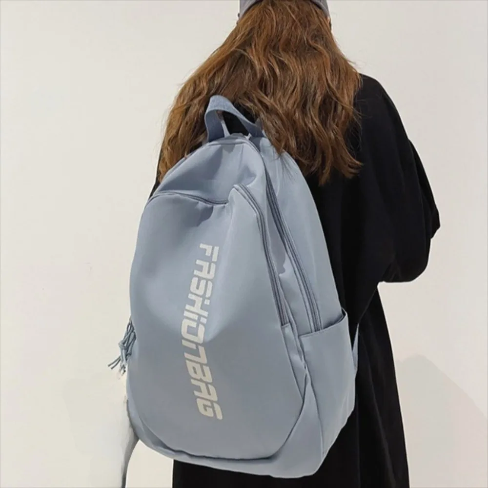 Nueva mochila escolar de gran capacidad, bolsa universitaria ligera con letras, bolsa de libros impermeable