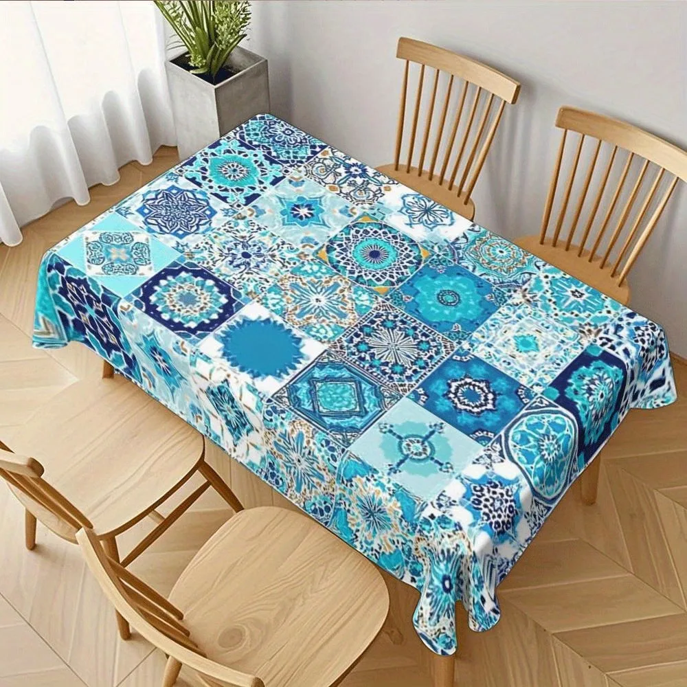 A polyester tablecloth with a continuous design of blue-green and blue Moroccan tiles