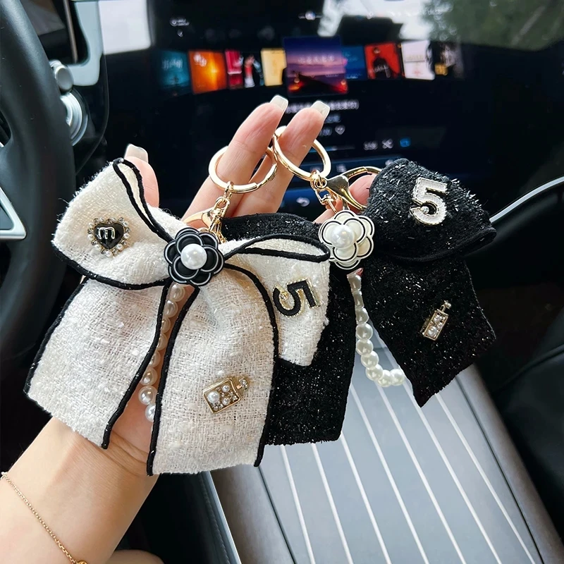 Creative Xiaoxiang Butterfly Knot Keychain Women's Fashion Pearl Chain Bag Pendant Personalized Ribbon Bow Tie Car Keychain