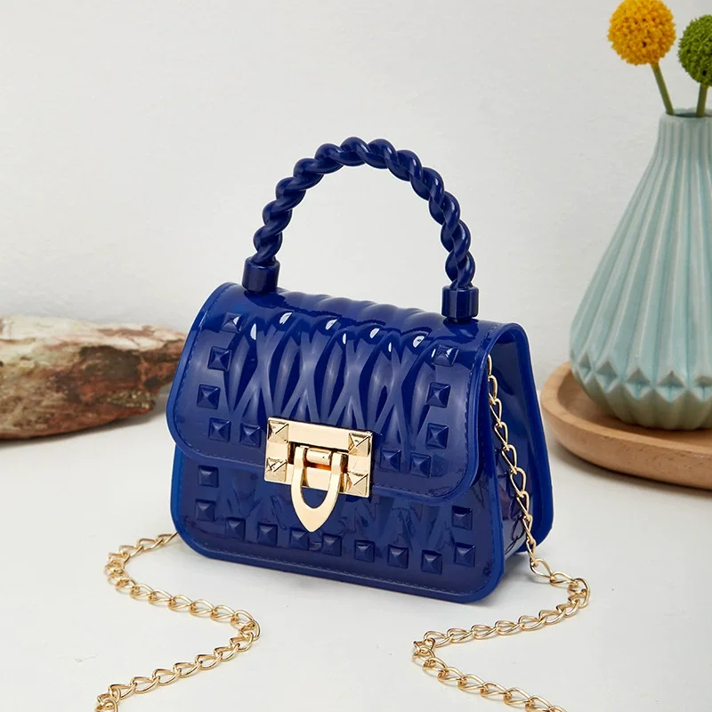 Nouvelle chaîne de verrouillage PVC Portable Mini sac de gelée Rivet une épaule bandoulière rouge à lèvres petit sac sacs pour femmes sacs à main