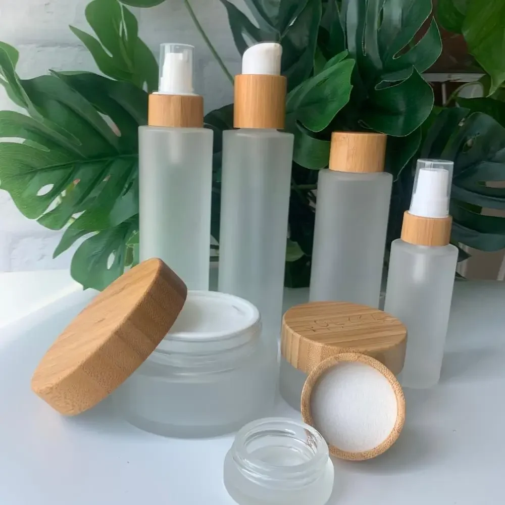

whosesale Biodegradable Frosted Glass Jar Biodegradable CBD oil Essence cream with caps Container with bamboo lid made in China