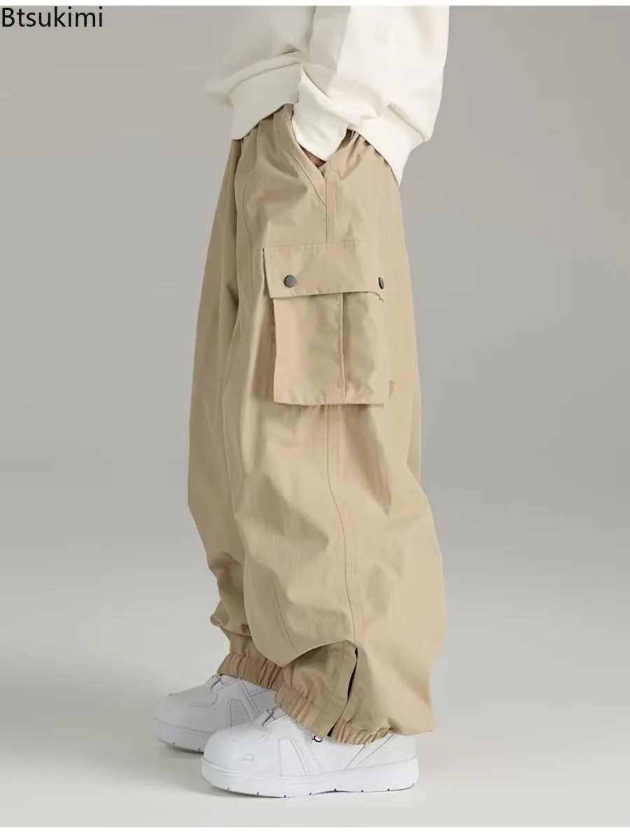 

New 2025 Spring and Autumn Waterproof Windproof Loose-fit Ski Pants for Men and Women Outdoor Sports Multi-pocket Casual Pants