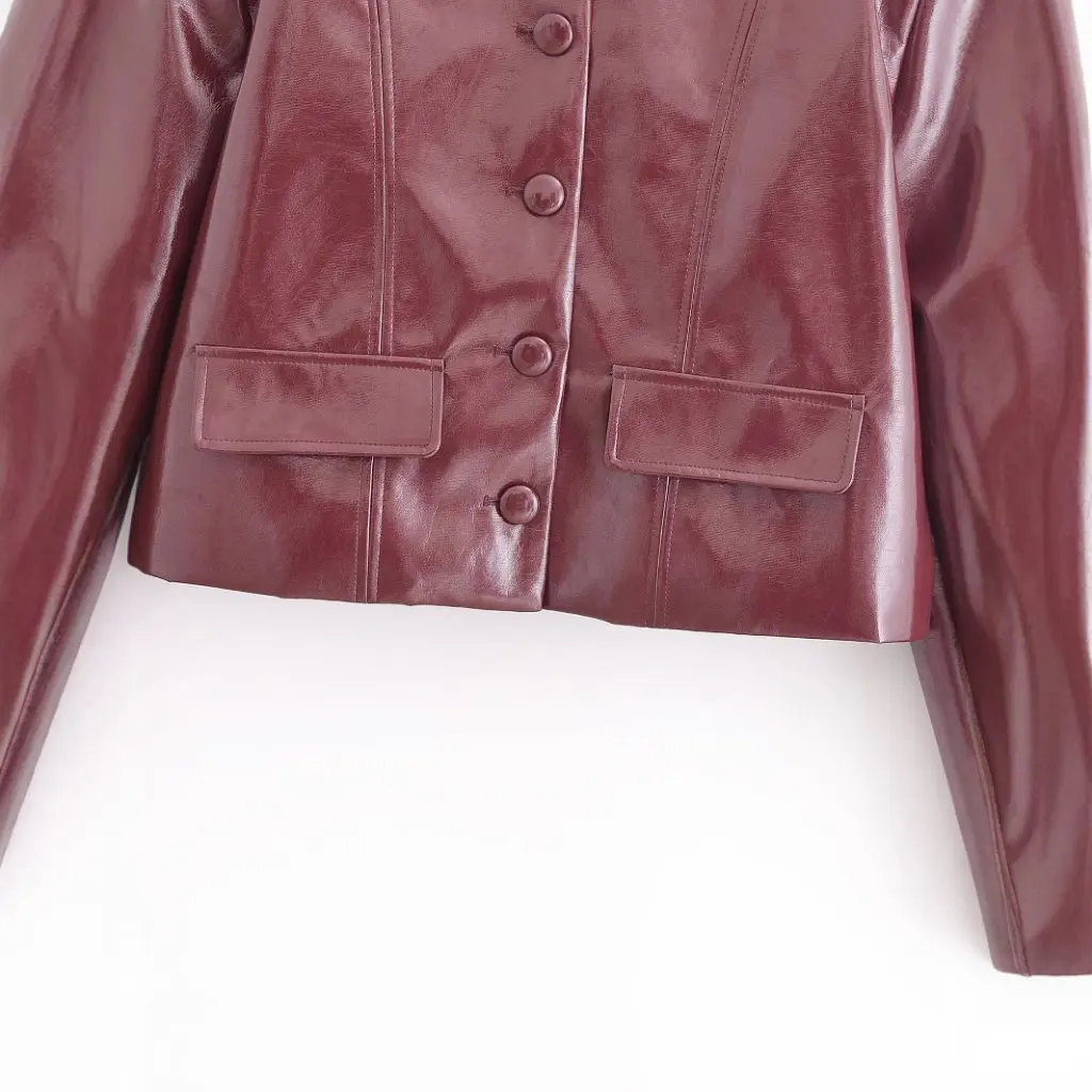 Moda europea y americana Color sólido cuello redondo chaqueta de cuero de imitación abrigo de mujer de manga larga primavera nuevo A769085