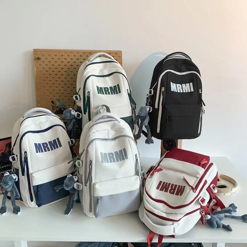 Mochilas de viaje para mujer, mochila negra Popular, mochilas deportivas de dibujos animados para mujer, bolsa de pareja Linda para niñas