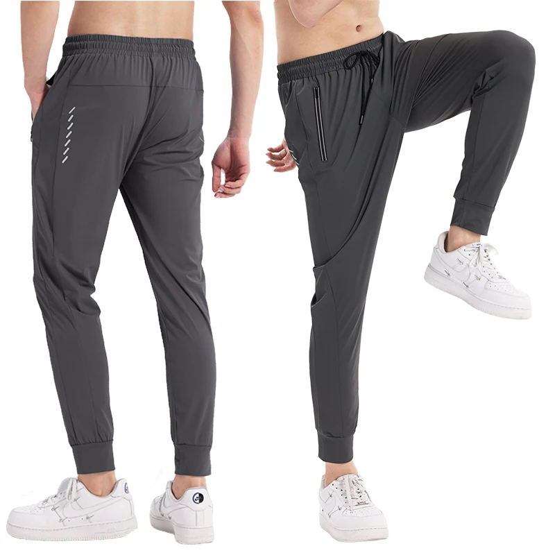 Pantalones transpirables de entrenamiento de atletismo para hombre, mallas delgadas y sueltas con bolsillos, ropa de ejercicio de gimnasio, leggings