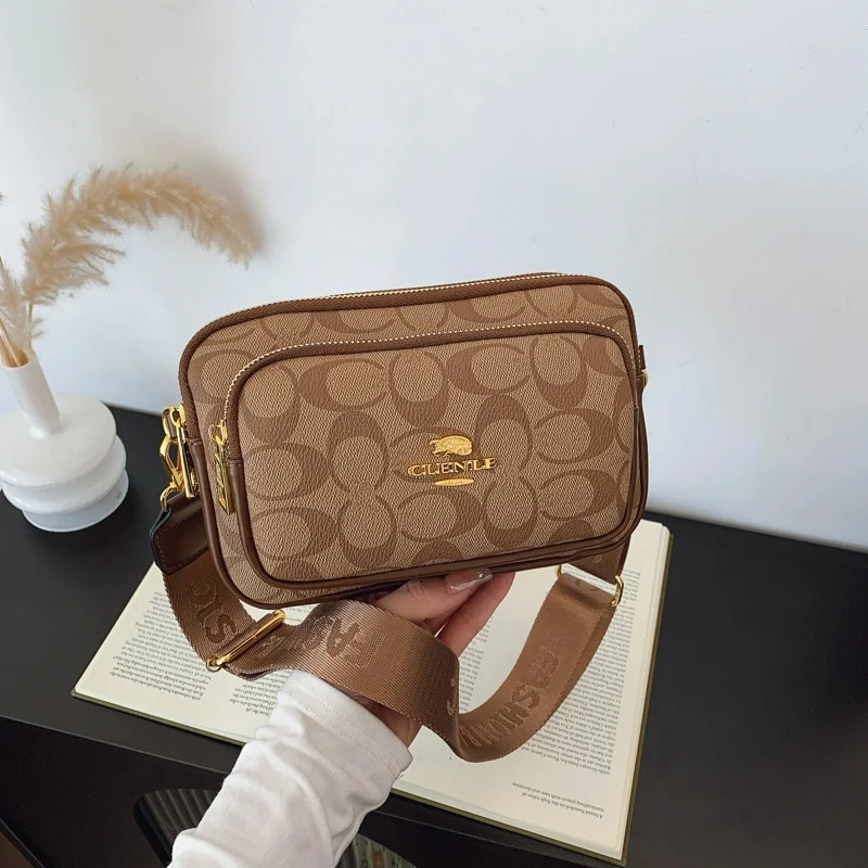 Classics Original Circular-Pattern Logo Crossbody: Retro-luxury, Durable Fabric, Adjustable Strap. Ideal for Daily/Work/Social U