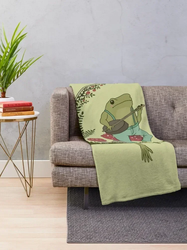 Cottagecore Aesthetic Frog Playing Banjo on Mushroom Cute Vintage - Goblincore Farmer Toad in Garden - Dark Academ Throw Blanket