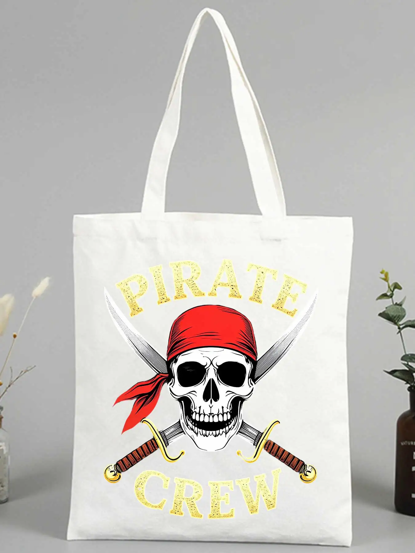 Women's skull graphic canvas tote bag with typography print, ideal for casual daily use and weekend outings