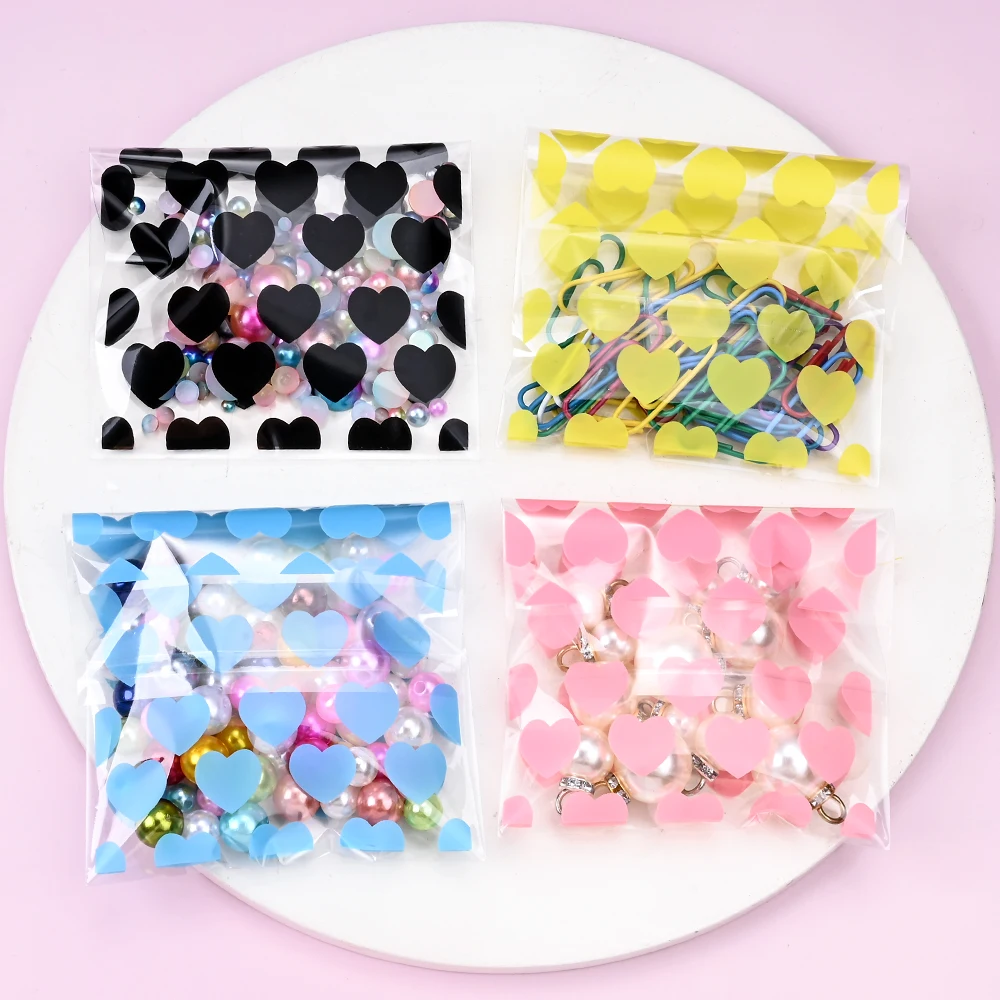 50 Stück OPP-Verpackungsbeutel mit Herzmuster, selbstklebende Beutel für Schmuck, Bastelarbeiten, Kleinteile, durchsichtige Verpackungsbeutel mit Reißverschluss – Detail 2