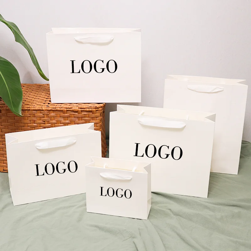 Bolsas de papel blancas con logotipo personalizado para ropa, paquetes de pelucas, bolsas pequeñas de papel para joyería de negocios, bolsas de boda