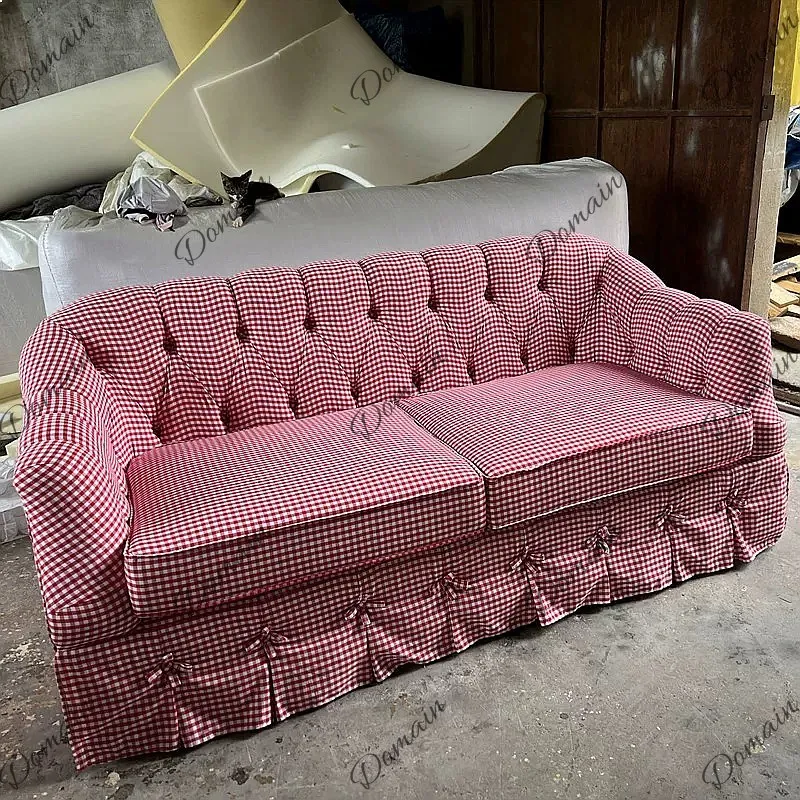 Retro style small red and white plaid sofa pastoral style small apartment skirt edge famous hotel photography photo