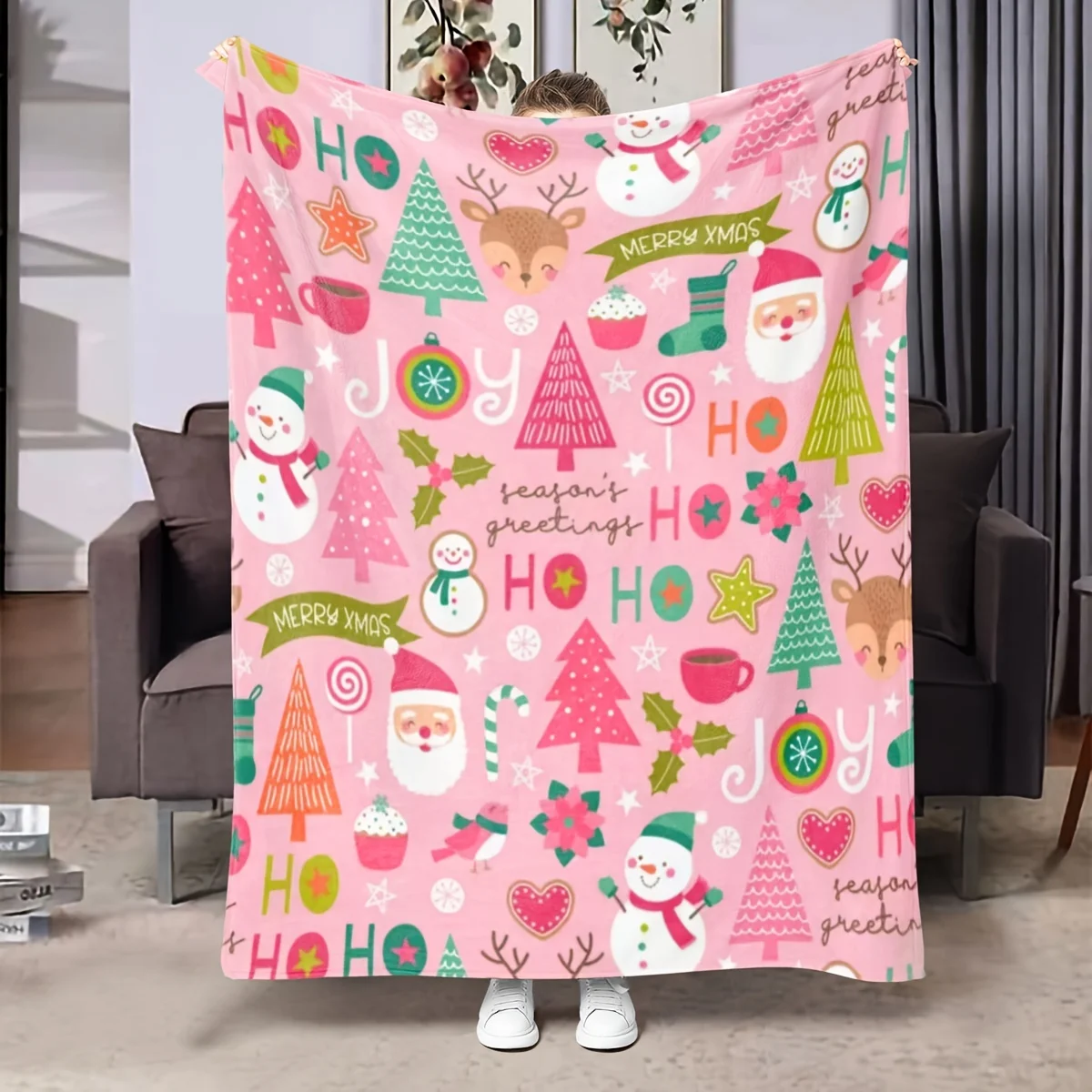 A Pink Christmas-themed Throw Blanket with Santa Claus, Cute Reindeer, Holly Leaves, and Snowman Prints. A Shawl Blanket, Lap Bl