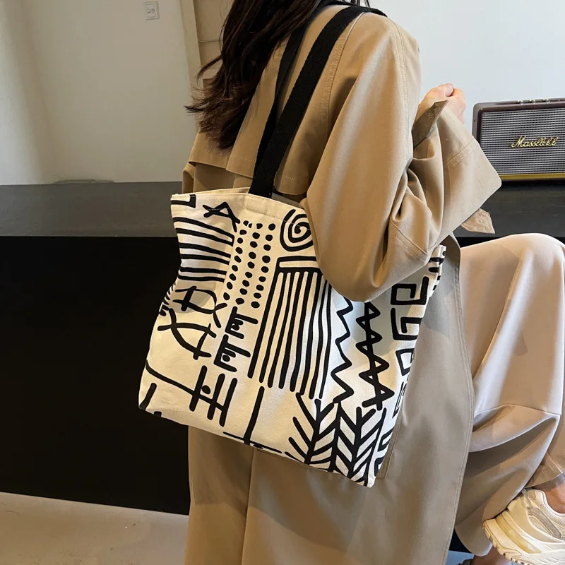 ファッションプリントストライプキャンバスバッグ、大容量裏地ハンドバッグ、キャンパス学生バックパック、若者の日常ショッピング文学用途