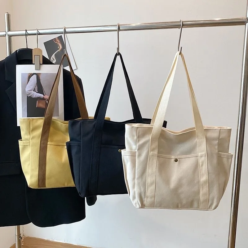 Thick canvas bags, handbags, large capacity commuting bags, with multiple functions, suitable for carrying when going out.