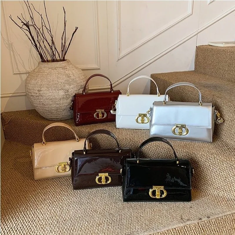 

Unique Designer Crossbody Handbag With Letter Logo Also Serves As A Fashionable And Roomy Diaper Bag
