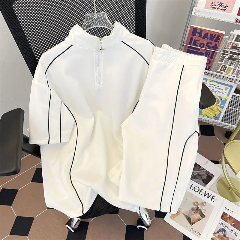 

Комплект американской повседневной спортивной одежды больших размеров: футболка с коротким рукавом и шорты до колен с молнией, новый дизайн для мужчин и женщин