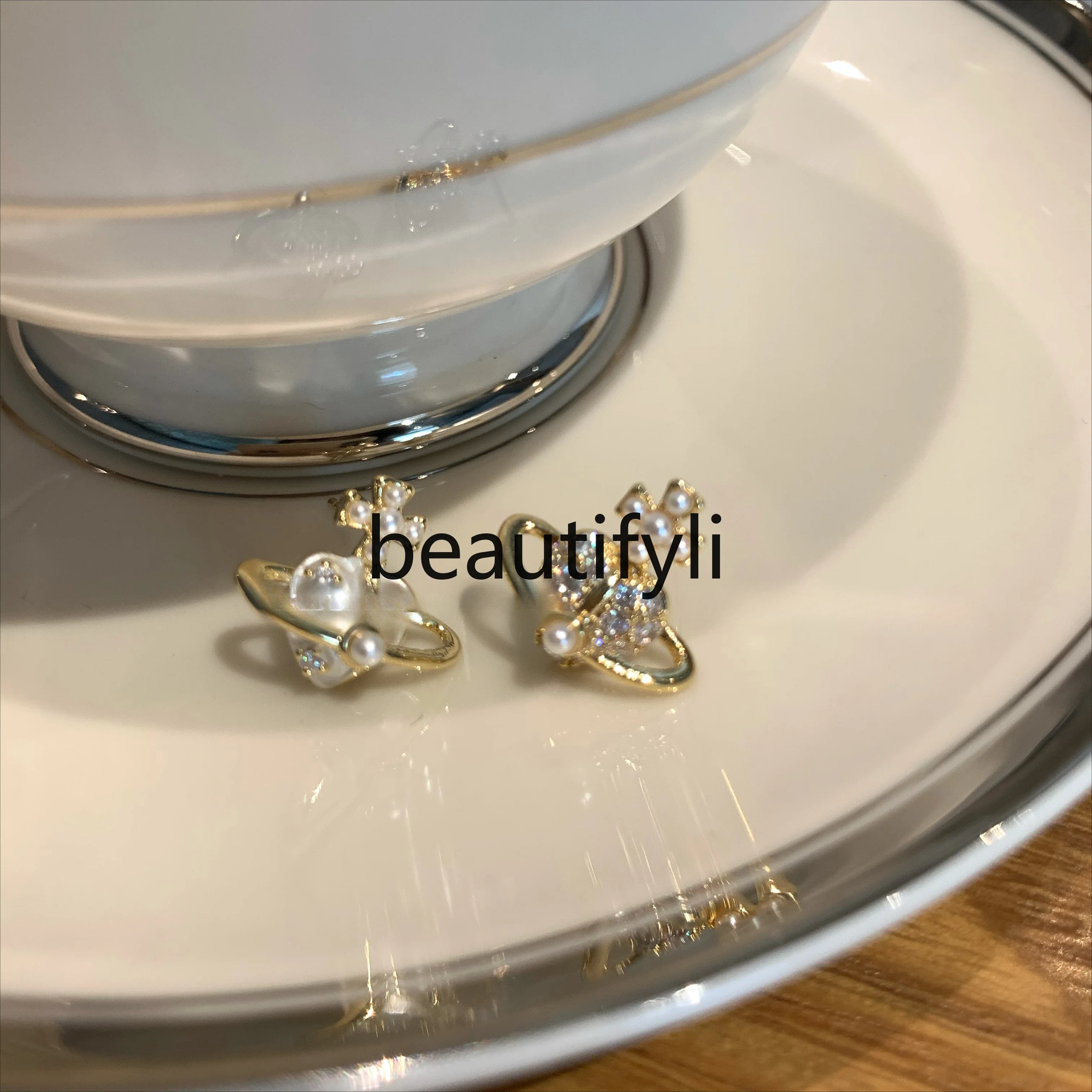 

Niche design asymmetrical pearl zircon stud earrings high-end delicate planet earrings