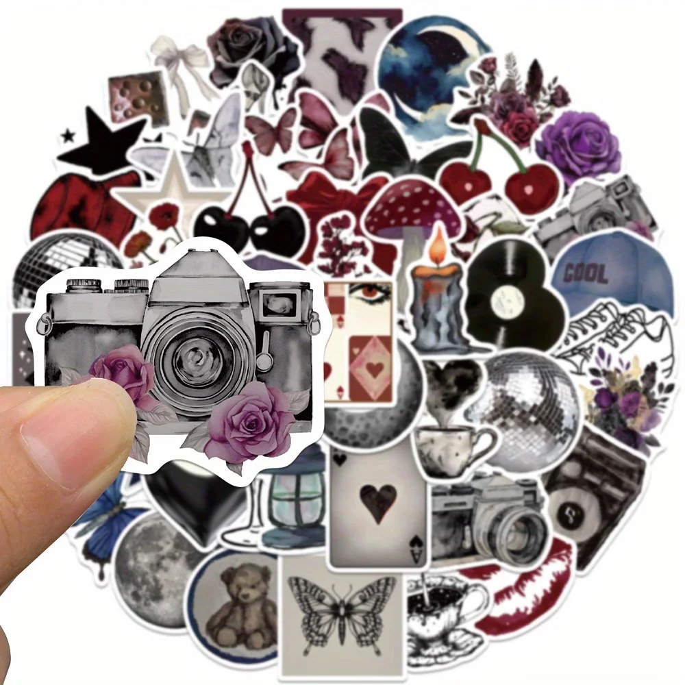 

В этом наборе содержится 50 уникальных наклеек в темном стиле — с элементами ретро-дизайна, такими как вишня, бабочки, луна, диско-шары, игры.