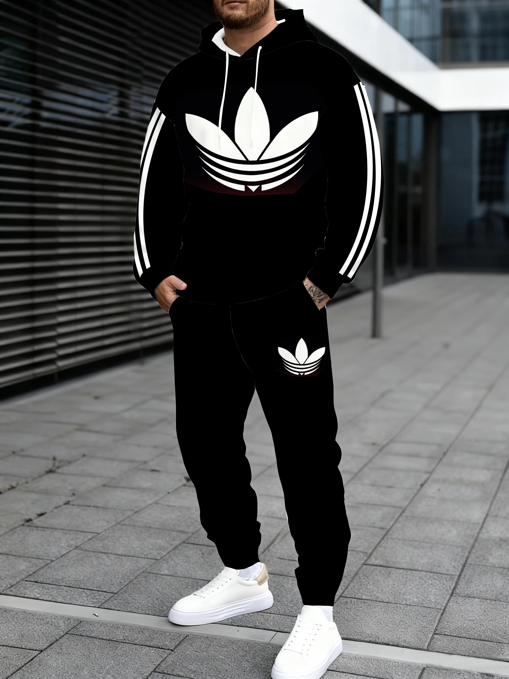 سويت شيرت رجالي بغطاء للرأس يقترن بنطال رياضي، مع خط هندسي بيضاوي متباين الألوان، ينبع نمط شارع متعدد الاستخدامات