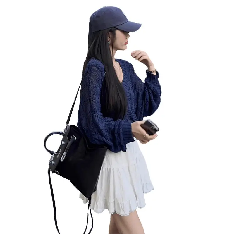 التخسيس تصميم تحسس الجوف خارج ضوء محبوك سترة المرأة Sle أوائل الربيع Faion رقيقة جوفاء تريكو الأعلى