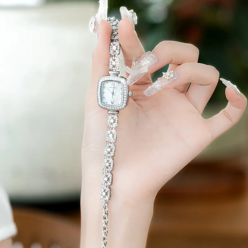 This petite mother-of-pearl square watch for women exudes sophistication with its delicate bracelet and versatile style.