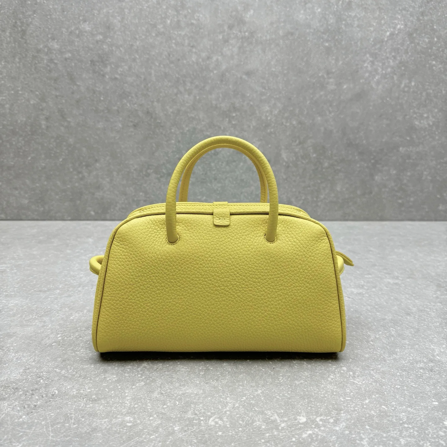 

2025 women top quality Litchi-patterned yellow bowling ball bag - new spring/summer style hand-held makeup bag