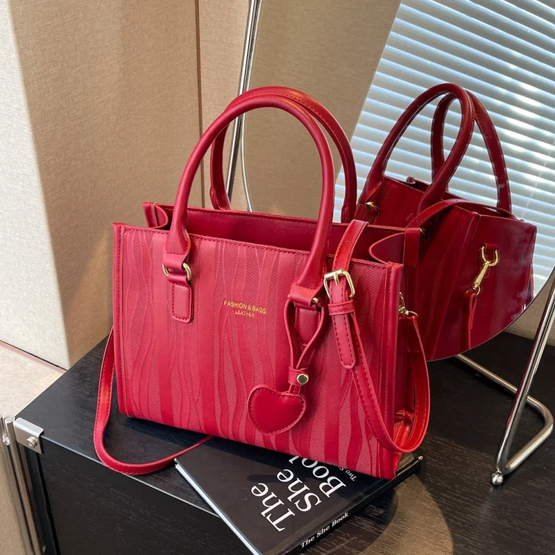 Bolso de boda rojo para mujer, bolsa de mano todo en uno de gran capacidad, bolso cruzado de un solo hombro, sentido Senior, nueva tendencia