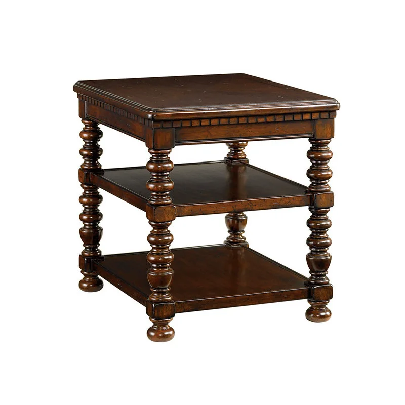 

There are a few solid wood lounge tables in the living room, and a few square telephones in the corner